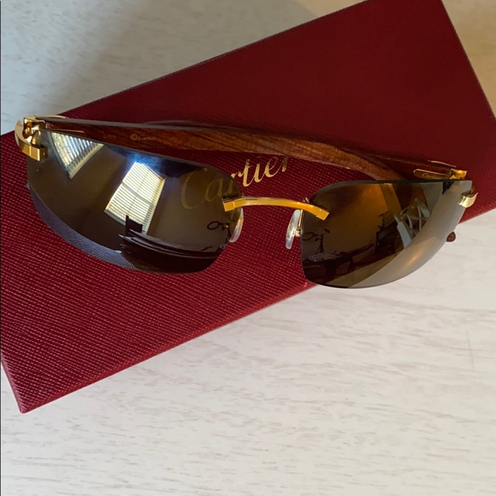 Wood framed Buffalo Cartier glasses.